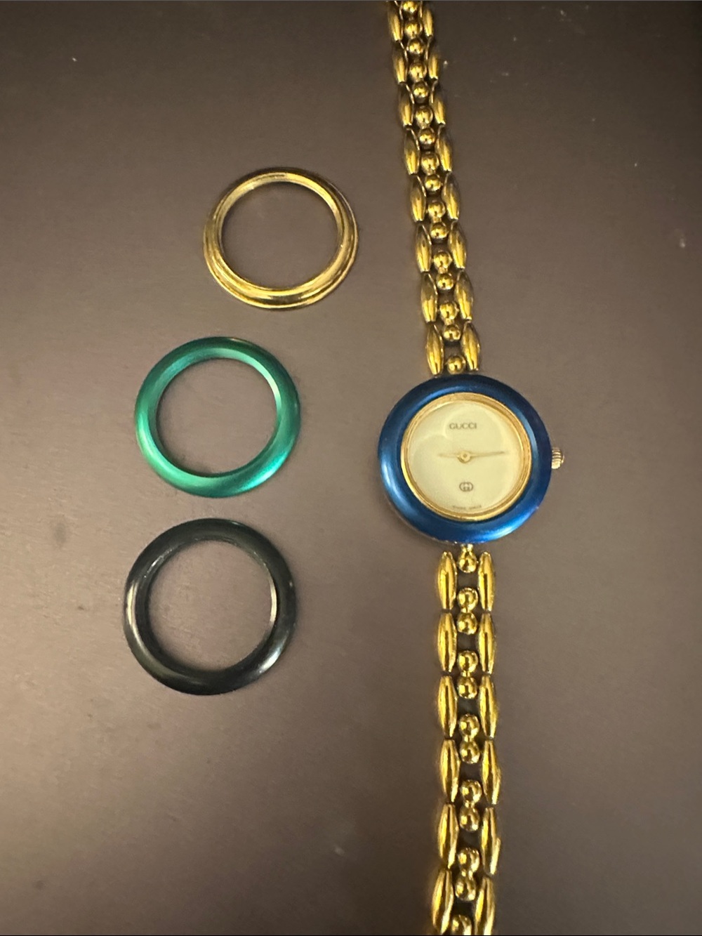 Gucci Gold-Tone Bracelet Watch with Blue, Green and Black Interchangeable Bezels